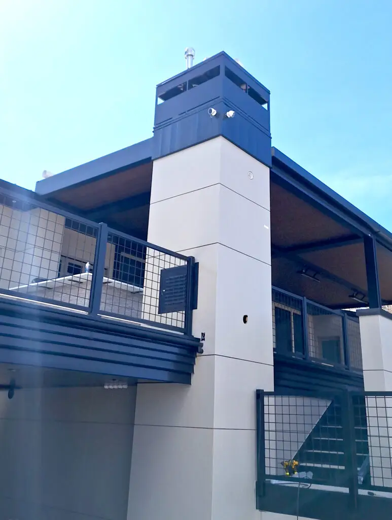 Modern exterior with custom metal paneling and steel railing system installed by Bald Ridge Enterprises on a commercial building in Wyoming.